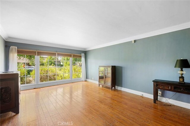 13617 Bassett St, Valley Glen, CA 91405 - unfurnished living room with crown molding and wood finished floors