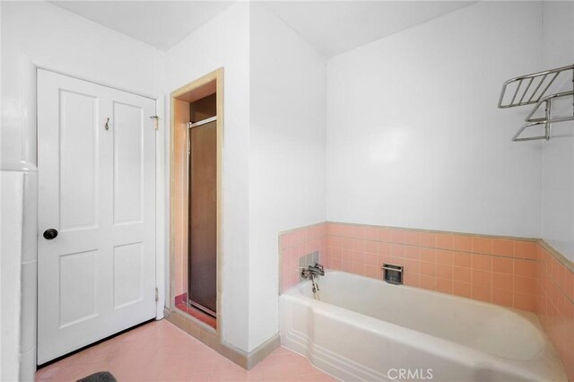 13617 Bassett St, Valley Glen, CA 91405 - bathroom featuring a garden tub, a stall shower, and tile patterned floors