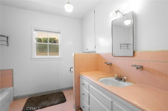 13617 Bassett St, Valley Glen, CA 91405 - bathroom featuring vanity, a bath, and tasteful backsplash