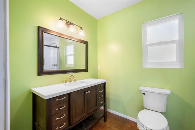 13617 Bassett St, Valley Glen, CA 91405 - bathroom featuring vanity, wood finished floors, plenty of natural light, and a shower