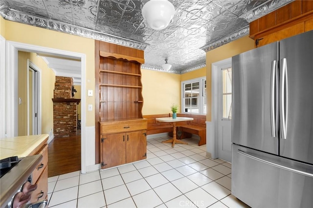 13617 Bassett St, Valley Glen, CA 91405 - kitchen with freestanding refrigerator, an ornate ceiling, open shelves, a wainscoted wall, and stove