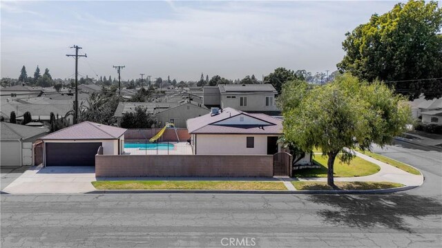 11676 Chesterton St, Norwalk, CA 90650 - view of front of house with a garage, concrete driveway, and a residential view