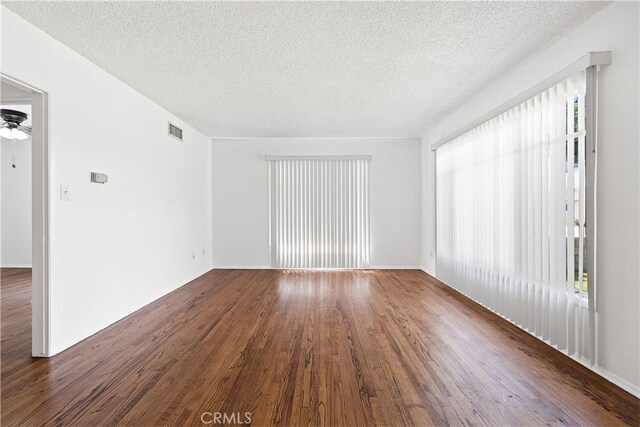 11676 Chesterton St, Norwalk, CA 90650 - unfurnished room featuring wood finished floors, a textured ceiling, and a ceiling fan