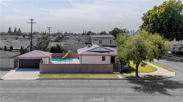 11676 Chesterton St, Norwalk, CA 90650 - view of front of property with a garage, driveway, a residential view, and stucco siding