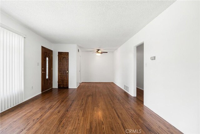 11676 Chesterton St, Norwalk, CA 90650 - empty room featuring ceiling fan, wood finished floors, and a textured ceiling