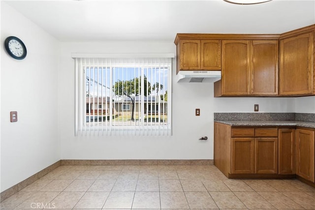 11676 Chesterton St, Norwalk, CA 90650 - washroom featuring baseboards and light tile patterned floors