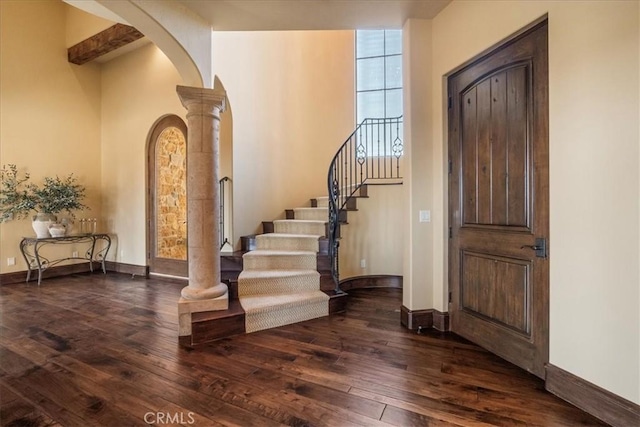 1470 Via Chaparral, Fallbrook, CA 92028 - foyer entrance with arched walkways, dark wood-style floors, decorative columns, and baseboards
