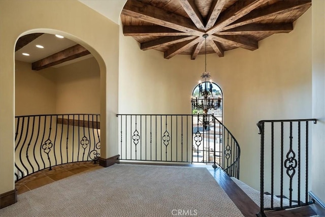 1470 Via Chaparral, Fallbrook, CA 92028 - hall with a chandelier, arched walkways, an upstairs landing, wooden ceiling with exposed beams, and recessed lighting
