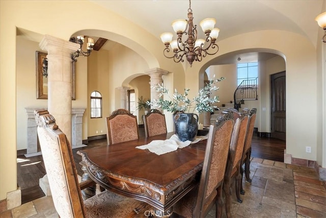 1470 Via Chaparral, Fallbrook, CA 92028 - dining room featuring a chandelier, stone tile floors, arched walkways, and baseboards