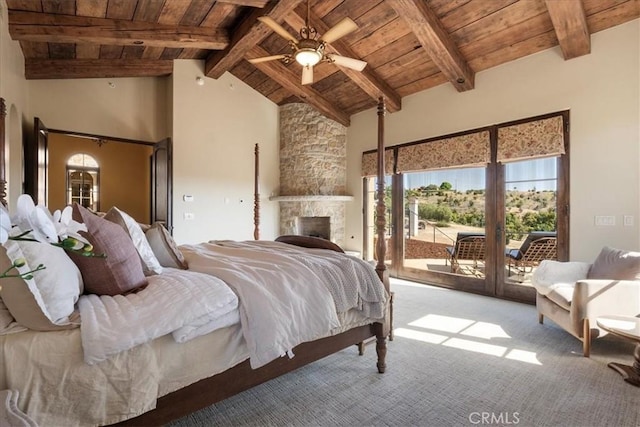 1470 Via Chaparral, Fallbrook, CA 92028 - bedroom with wood ceiling with exposed beams, access to exterior, carpet, multiple windows, and a stone fireplace