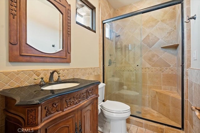 1470 Via Chaparral, Fallbrook, CA 92028 - full bathroom with toilet, tile walls, vanity, a shower stall, and wainscoting