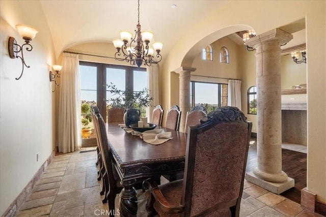1470 Via Chaparral, Fallbrook, CA 92028 - dining space featuring stone tile flooring, arched walkways, decorative columns, healthy amount of natural light, and high vaulted ceiling
