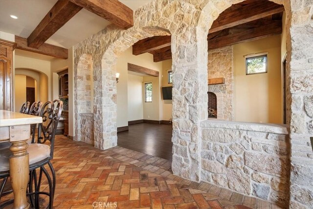 1470 Via Chaparral, Fallbrook, CA 92028 - corridor with beamed ceiling, healthy amount of natural light, arched walkways, and baseboards