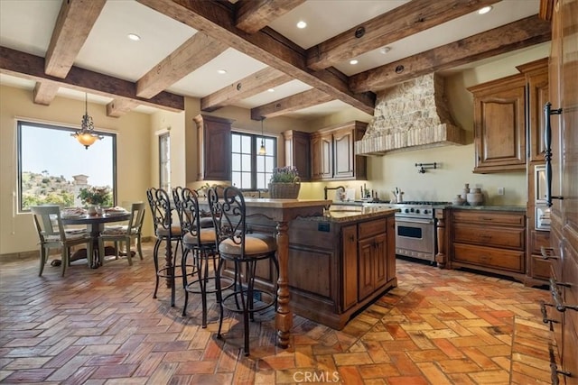 1470 Via Chaparral, Fallbrook, CA 92028 - kitchen with high end stove, custom range hood, a kitchen breakfast bar, beamed ceiling, and a sink