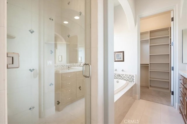 1470 Via Chaparral, Fallbrook, CA 92028 - full bath featuring a stall shower, vanity, tile patterned flooring, a garden tub, and a spacious closet