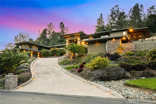 3386 Canyon Oaks Ter, Chico, CA 95928 - view of front of house featuring stone siding and asphalt driveway