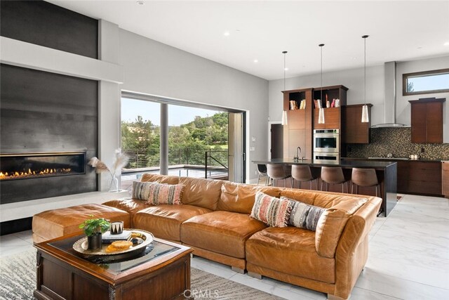 3386 Canyon Oaks Ter, Chico, CA 95928 - living area featuring a glass covered fireplace and recessed lighting