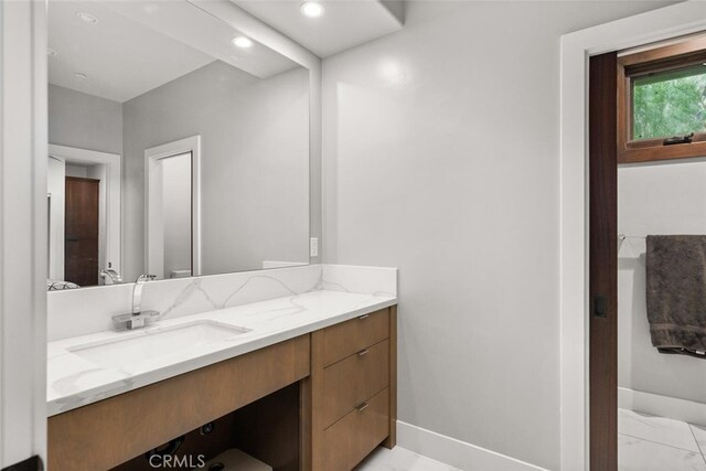 3386 Canyon Oaks Ter, Chico, CA 95928 - bathroom with vanity, baseboards, recessed lighting, and marble look tiles