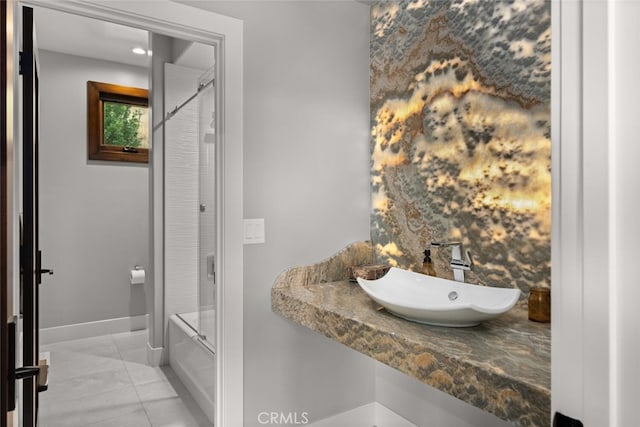 3386 Canyon Oaks Ter, Chico, CA 95928 - full bathroom with a sink, marble look tile flooring, baseboards, and bathtub / shower combination