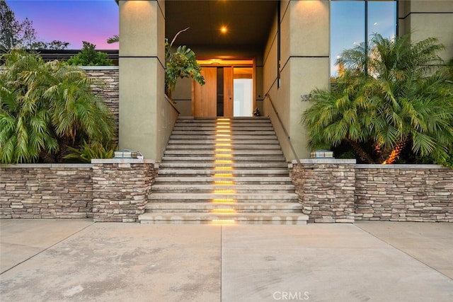 3386 Canyon Oaks Ter, Chico, CA 95928 - exterior entry at dusk featuring stucco siding