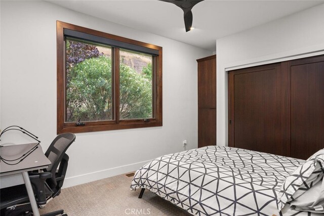 3386 Canyon Oaks Ter, Chico, CA 95928 - carpeted bedroom featuring a closet, baseboards, and an office area
