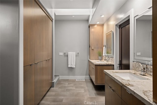 3386 Canyon Oaks Ter, Chico, CA 95928 - bathroom with baseboards, two vanities, and recessed lighting