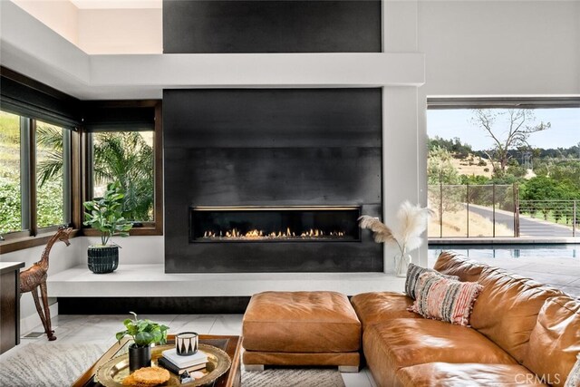 3386 Canyon Oaks Ter, Chico, CA 95928 - living area featuring a lit fireplace