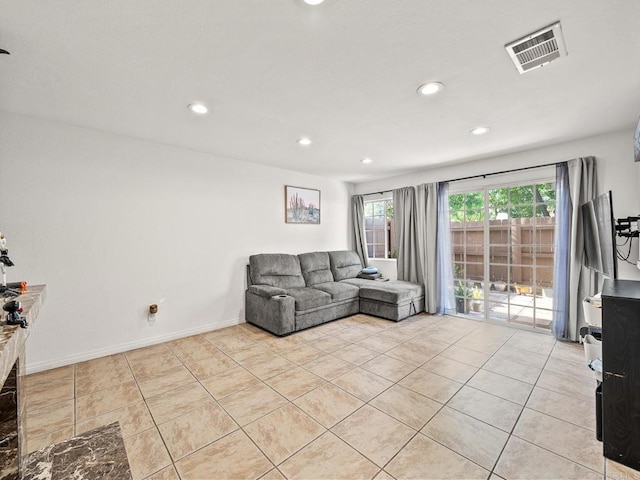 1465 E Lexington Ave Unit 11C, El Cajon, CA 92019 - living room with recessed lighting, light tile patterned flooring, and baseboards