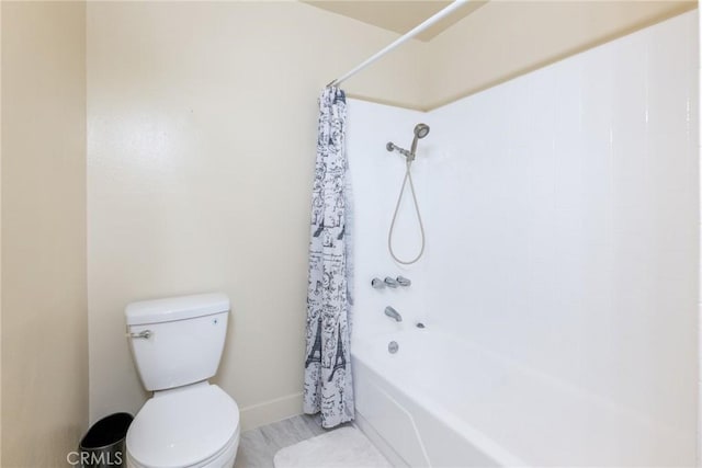 8804 Valley View St Unit C, Buena Park, CA 90620 - bathroom featuring toilet, shower / bath combo with shower curtain, and baseboards