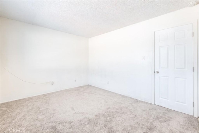 8804 Valley View St Unit C, Buena Park, CA 90620 - carpeted spare room featuring a textured ceiling and a smoke detector