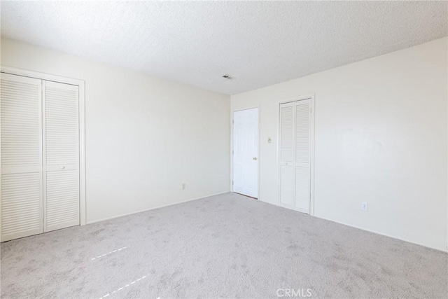 8804 Valley View St Unit C, Buena Park, CA 90620 - unfurnished bedroom featuring carpet floors and a textured ceiling