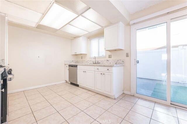 8804 Valley View St Unit C, Buena Park, CA 90620 - kitchen featuring a sink, dishwasher, white cabinetry, baseboards, and light stone counters