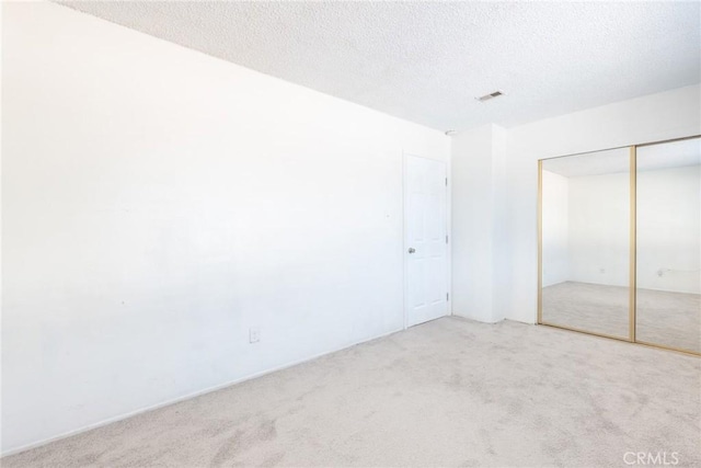 8804 Valley View St Unit C, Buena Park, CA 90620 - unfurnished bedroom with carpet floors, a closet, and a textured ceiling