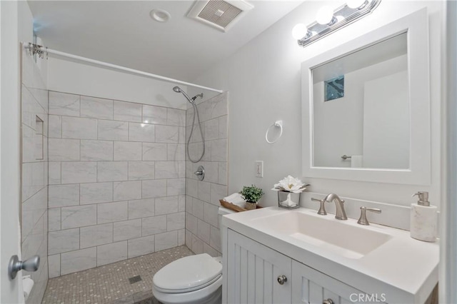 8521 Ranchito Ave, Panorama City, CA 91402 - bathroom featuring vanity, toilet, and tiled shower