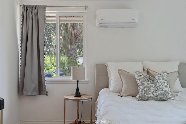 8521 Ranchito Ave, Panorama City, CA 91402 - bedroom with a wall mounted air conditioner and baseboards