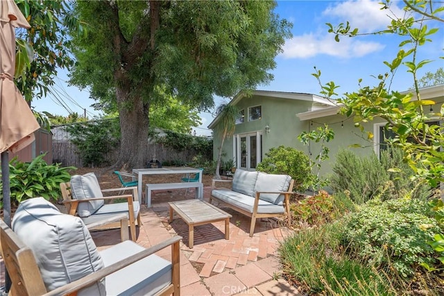 8521 Ranchito Ave, Panorama City, CA 91402 - fenced backyard with an outdoor hangout area, french doors, and a patio area