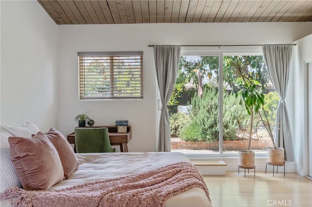 8521 Ranchito Ave, Panorama City, CA 91402 - bedroom featuring multiple windows, wood finished floors, and wood ceiling