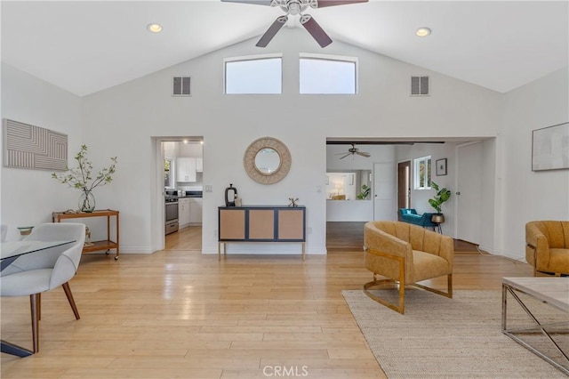 8521 Ranchito Ave, Panorama City, CA 91402 - living area featuring ceiling fan, light wood finished floors, high vaulted ceiling, baseboards, and recessed lighting