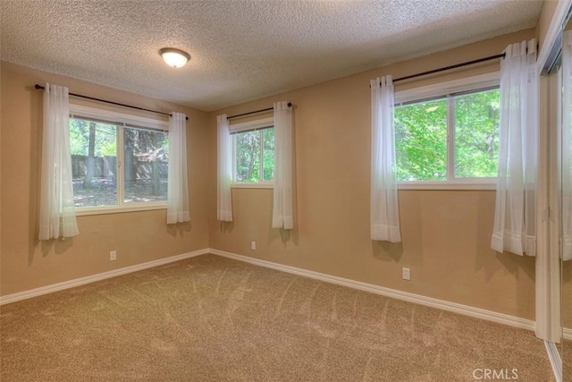 6125 Desabla Ln, Magalia, CA 95954 - carpeted spare room with a textured ceiling and baseboards