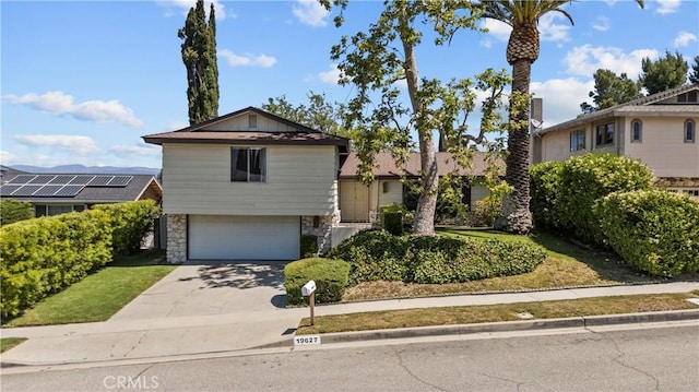 19627 Goldstream Way, Newhall, CA 91321 - view of front facade with stone siding, a garage, and concrete driveway