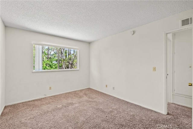 19627 Goldstream Way, Newhall, CA 91321 - spare room featuring carpet floors, a textured ceiling, and baseboards