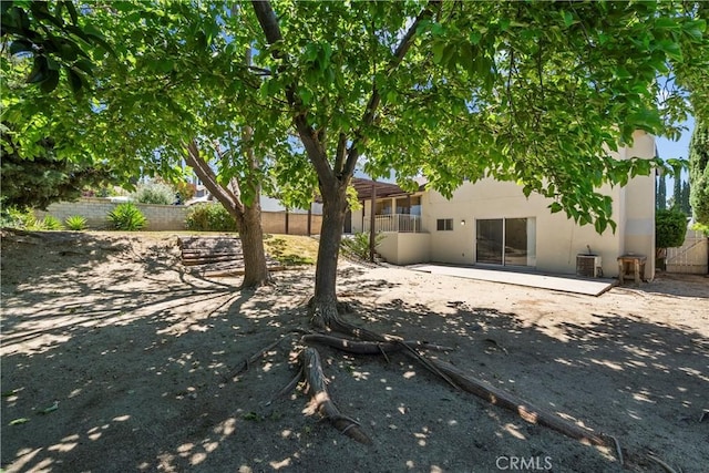 19627 Goldstream Way, Newhall, CA 91321 - back of house with stucco siding, a patio area, and a fenced backyard