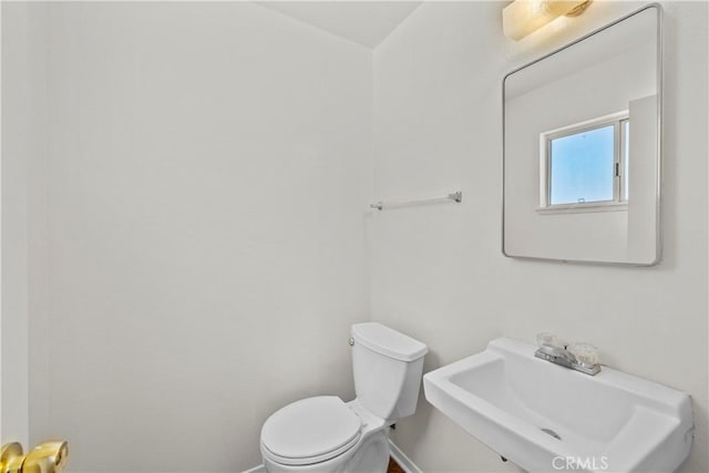19627 Goldstream Way, Newhall, CA 91321 - bathroom featuring a sink, toilet, and baseboards
