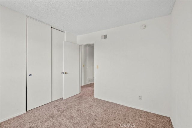 19627 Goldstream Way, Newhall, CA 91321 - unfurnished bedroom with carpet flooring, a textured ceiling, and a closet