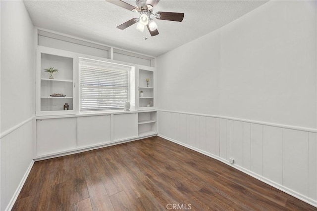 1418 E Wilshire Ave, Fullerton, CA 92831 - empty room featuring wood finished floors, ceiling fan, a wainscoted wall, a decorative wall, and a textured ceiling