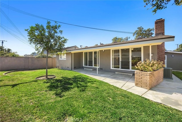 1418 E Wilshire Ave, Fullerton, CA 92831 - back of house with a chimney, a patio, stucco siding, and central AC