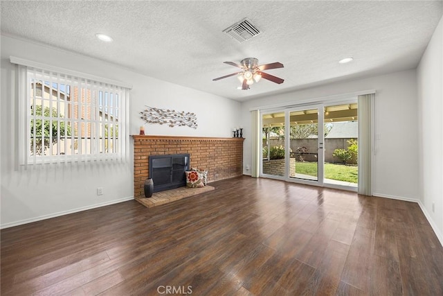 1418 E Wilshire Ave, Fullerton, CA 92831 - unfurnished living room featuring a textured ceiling, a ceiling fan, wood finished floors, baseboards, and a fireplace