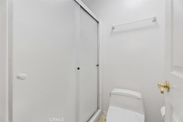 17152 Pacific Coast Unit 19, Huntington Beach, CA 92649 - bathroom featuring toilet and a stall shower