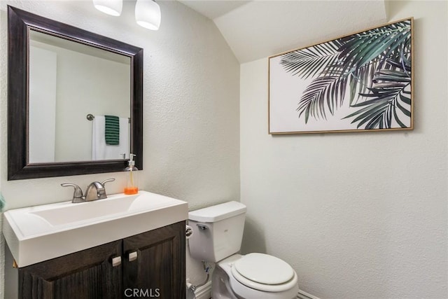 2209 E Badillo St, Covina, CA 91724 - bathroom featuring vaulted ceiling, toilet, a textured wall, and vanity