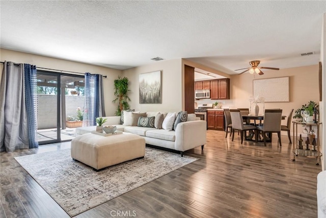 2209 E Badillo St, Covina, CA 91724 - living area with a ceiling fan, dark wood-type flooring, and a textured ceiling